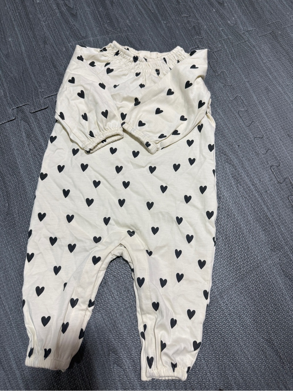 Hanna Andersson Cream Baby Jumpsuit with Black Heart Print